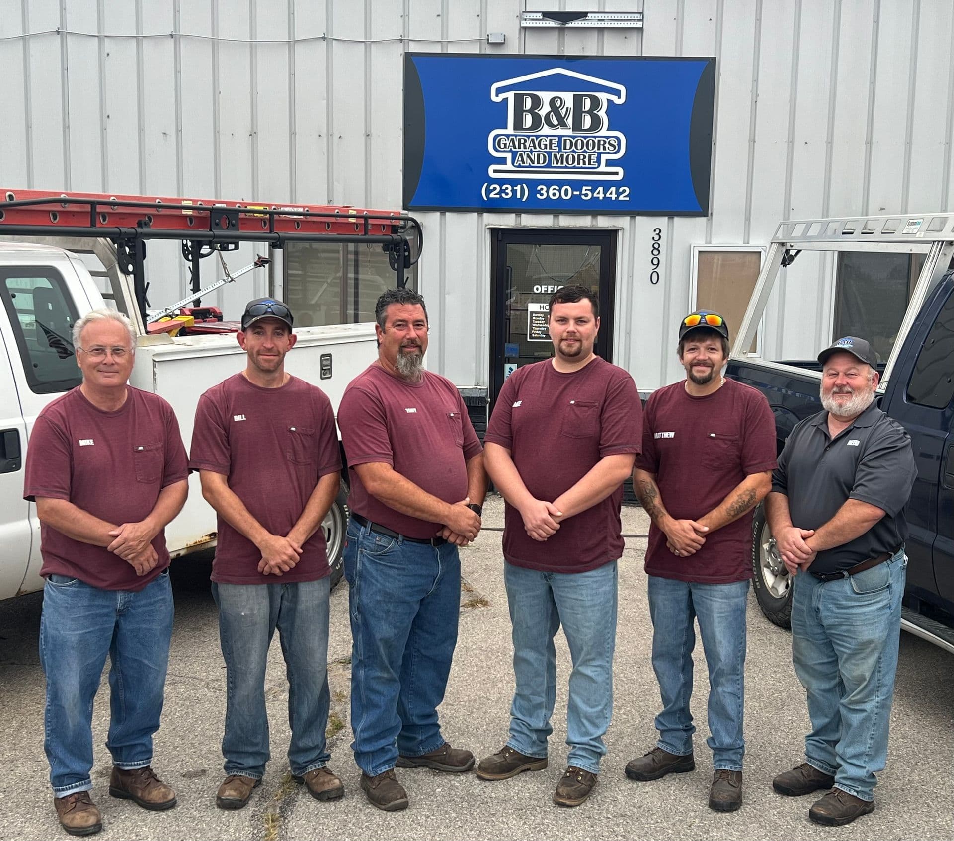 The B&B crew standing inside the shop